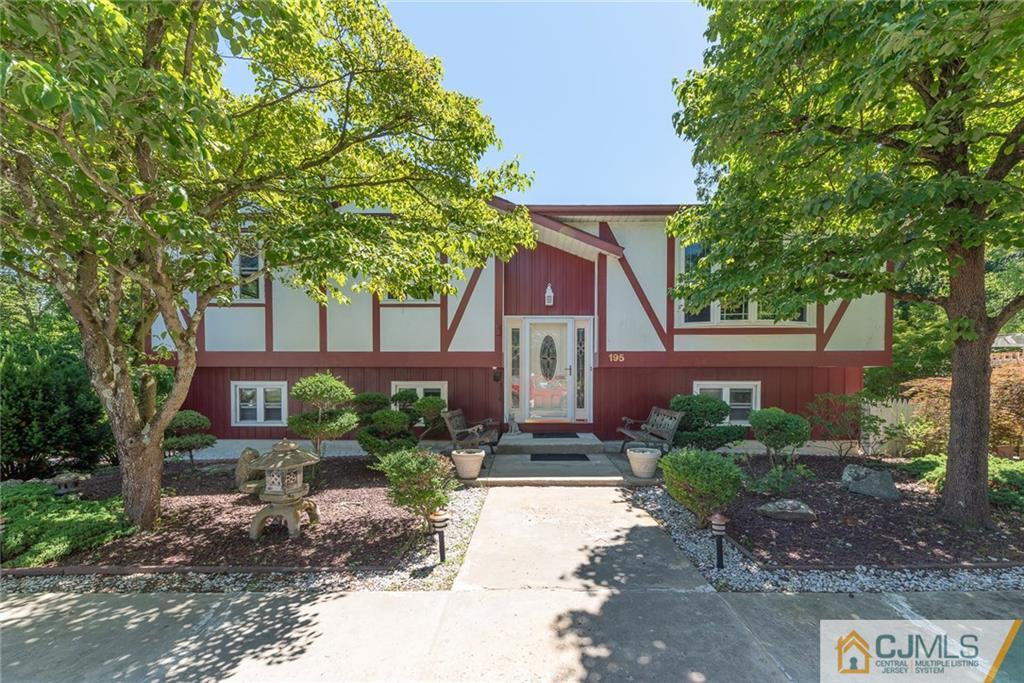 195 North New Prospect Road Jackson, NJ 08527 - Photo 1 of 25 a front view of a house with garden