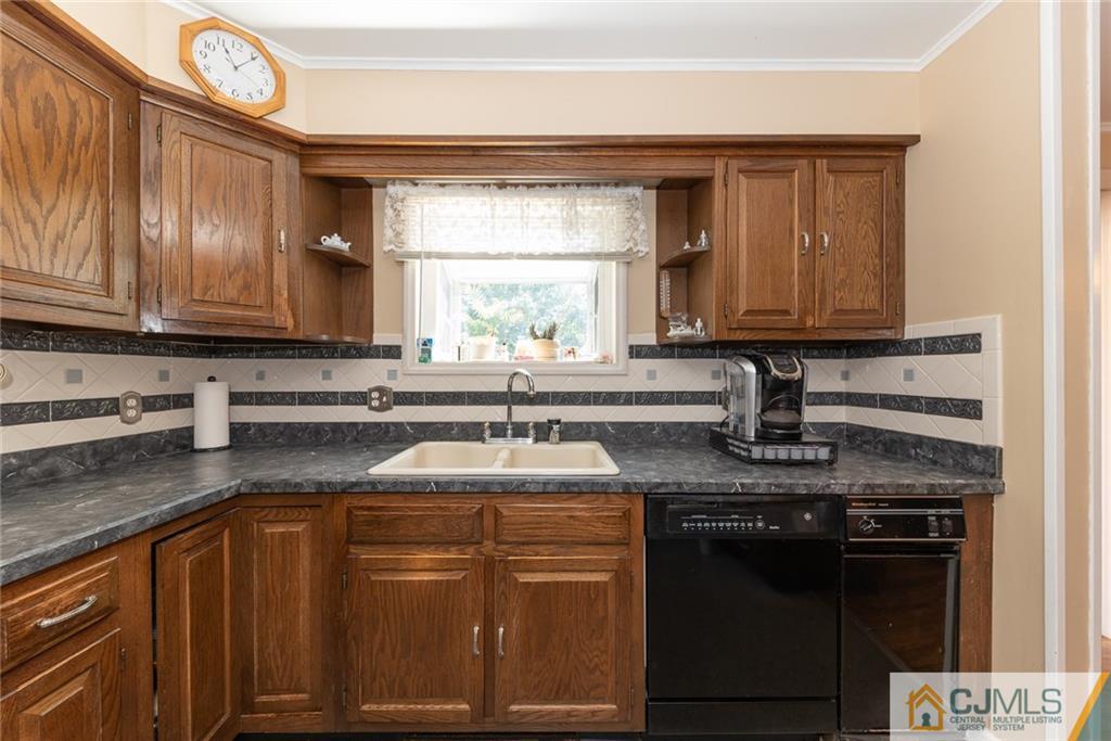 195 North New Prospect Road Jackson, NJ 08527 - Photo 11 of 25 a kitchen with stainless steel appliances granite countertop a sink stove and cabinets