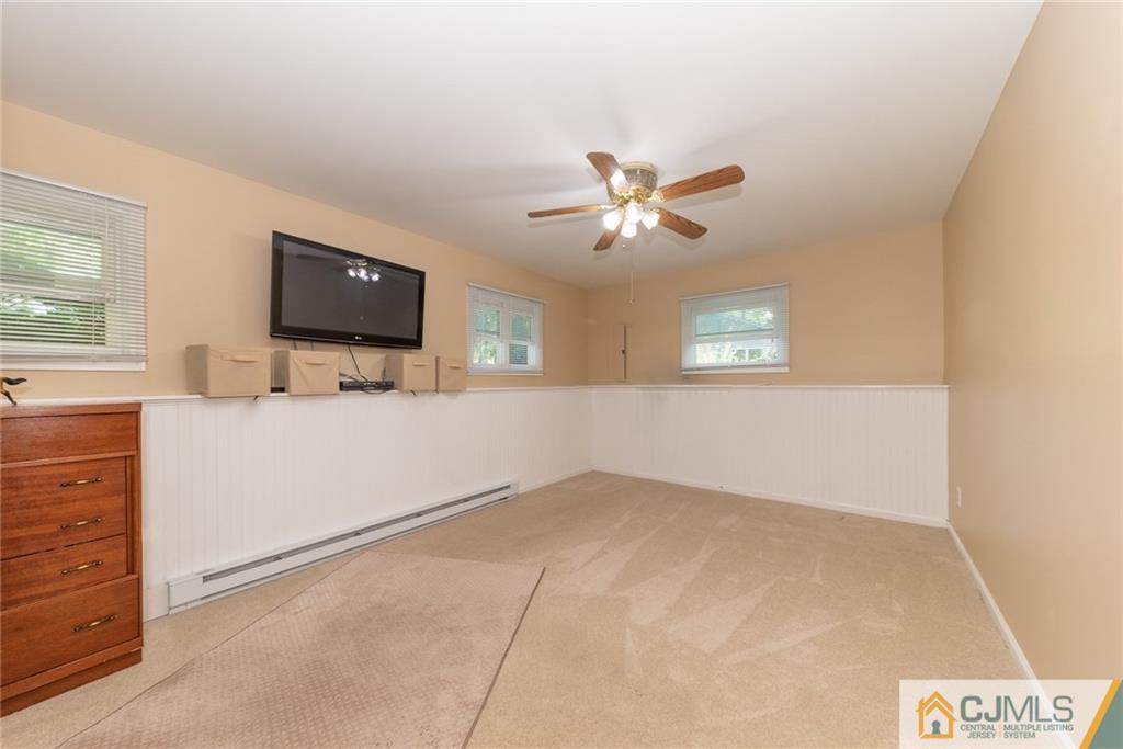 195 North New Prospect Road Jackson, NJ 08527 - Photo 15 of 25 an empty room with windows and cabinet