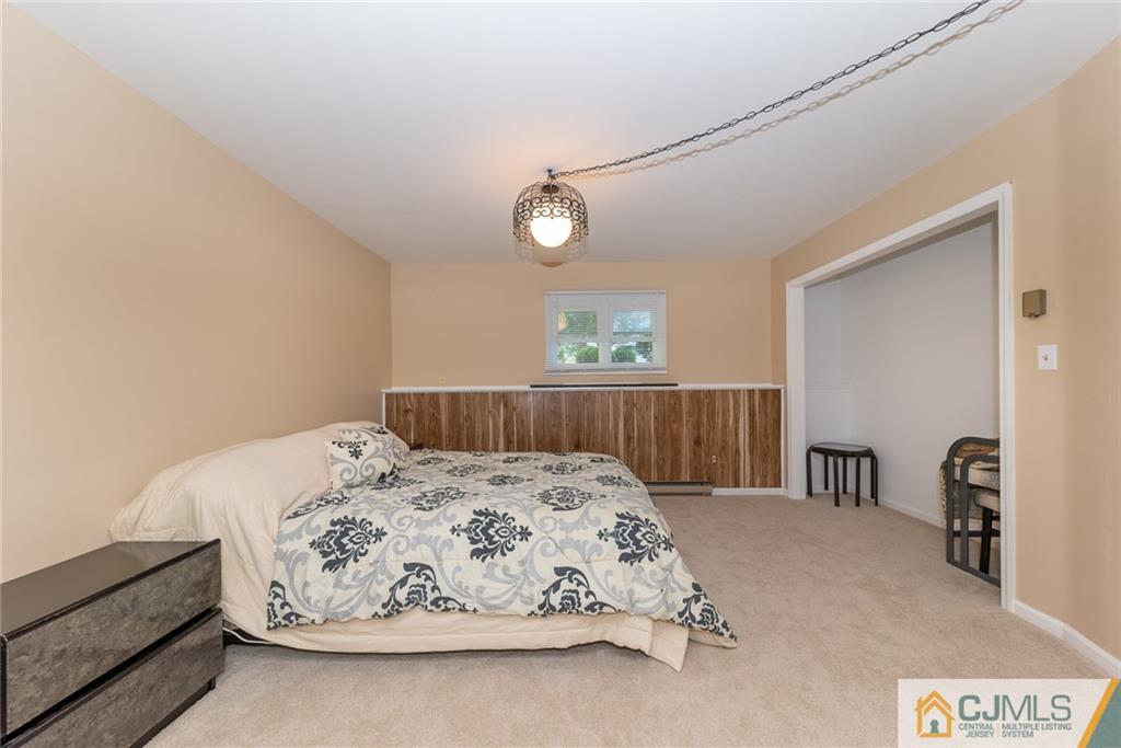 195 North New Prospect Road Jackson, NJ 08527 - Photo 18 of 25 a bedroom with a bed and a window