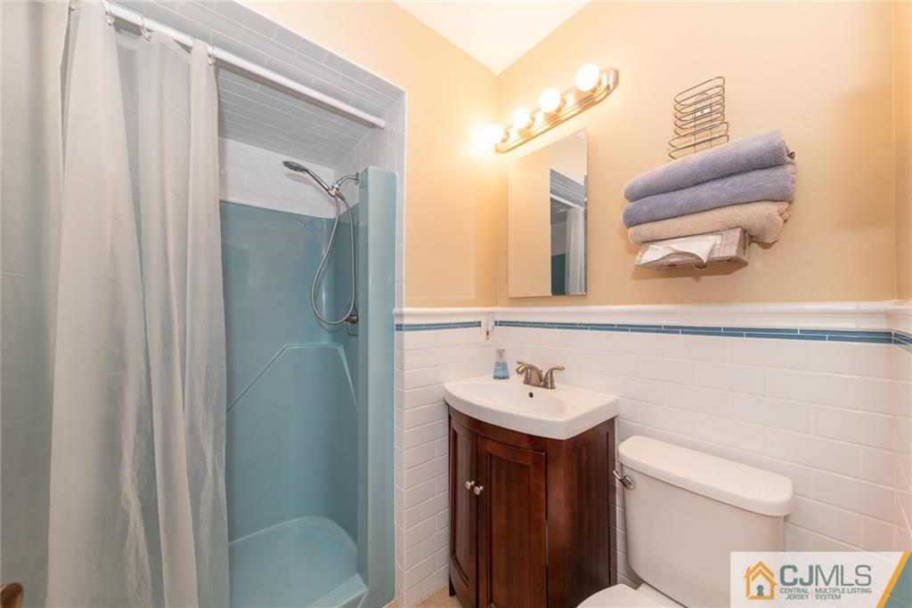 195 North New Prospect Road Jackson, NJ 08527 - Photo 19 of 25 a bathroom with a sink a toilet and shower
