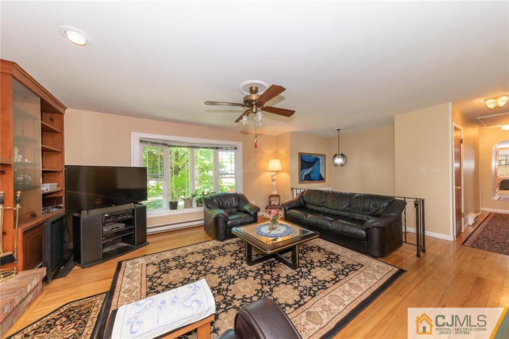 195 North New Prospect Road Jackson, NJ 08527 - Photo 4 of 25 a living room with furniture and a flat screen tv