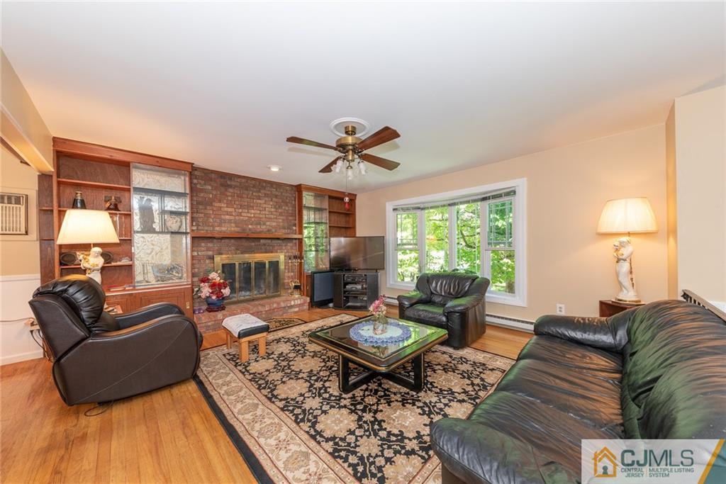 195 North New Prospect Road Jackson, NJ 08527 - Photo 5 of 25 a living room with furniture fireplace and a large window
