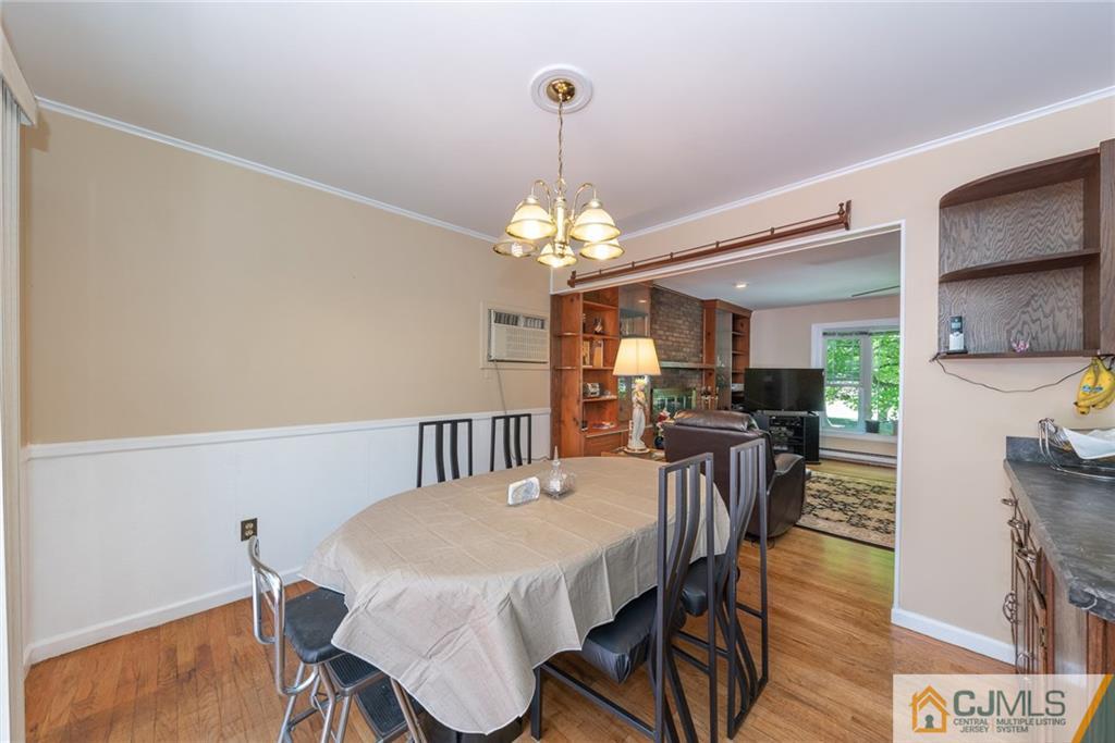 195 North New Prospect Road Jackson, NJ 08527 - Photo 6 of 25 a view of a dining room with furniture and wooden floor