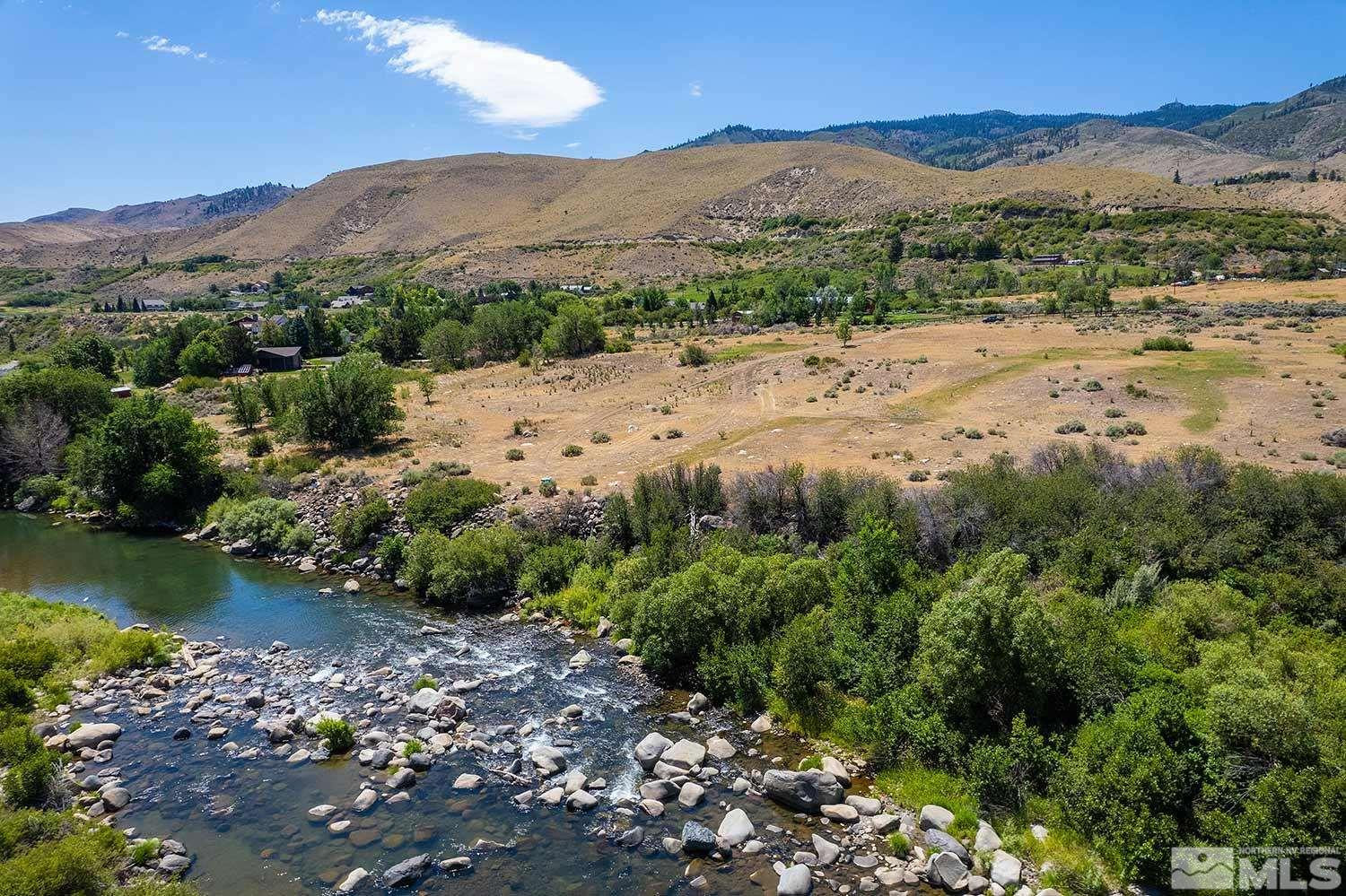 3205 Mario Road Verdi, NV 89523 - Photo 4 of 18 a view of a lake with mountains in the background