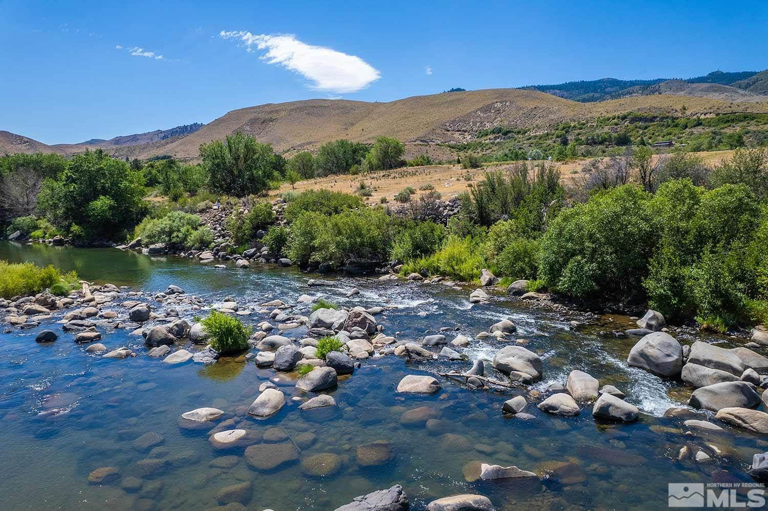 3205 Mario Road Verdi, NV 89523 - Photo 6 of 18 a view of a lake with a mountain in the background