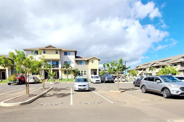 a view of a cars park on the roadside