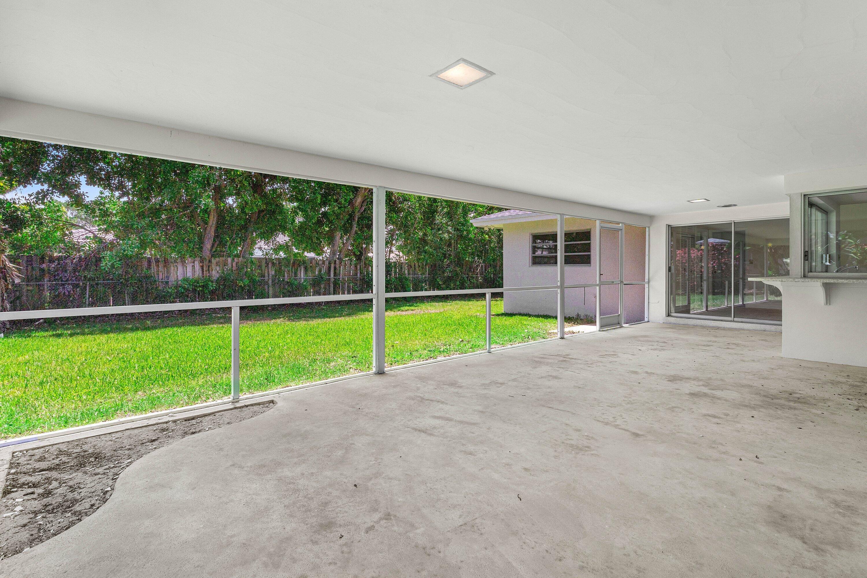 1000 Northwest 7th Street Boca Raton, FL 33486 - Photo 21 of 28 Covered screened porch