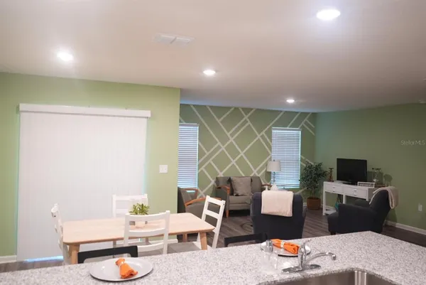 a spacious bedroom with a bed and a couch
