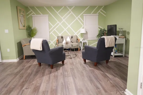 a living room with furniture and a window