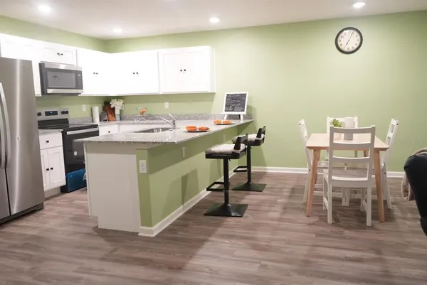 a living room with furniture and a table