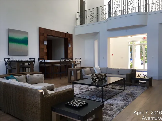 a view of a lake with lawn chairs