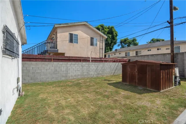 a view of a backyard of the house