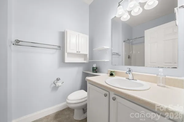 a bathroom with a sink toilet and vanity