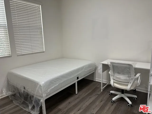 a room with a bed a table and chair