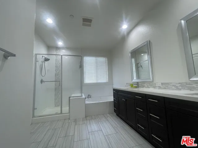 a view of bathroom with a sink mirror and toilet