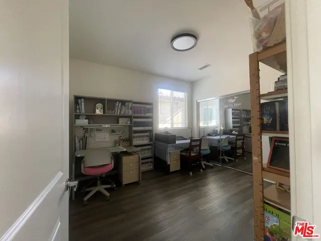 a living room with lots of furniture and a fireplace