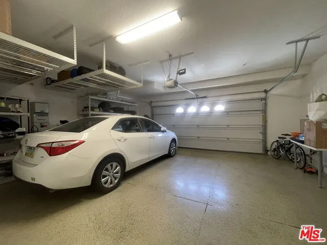 a view of a garage and car parked