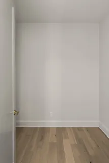 a view of a brick house with a patio