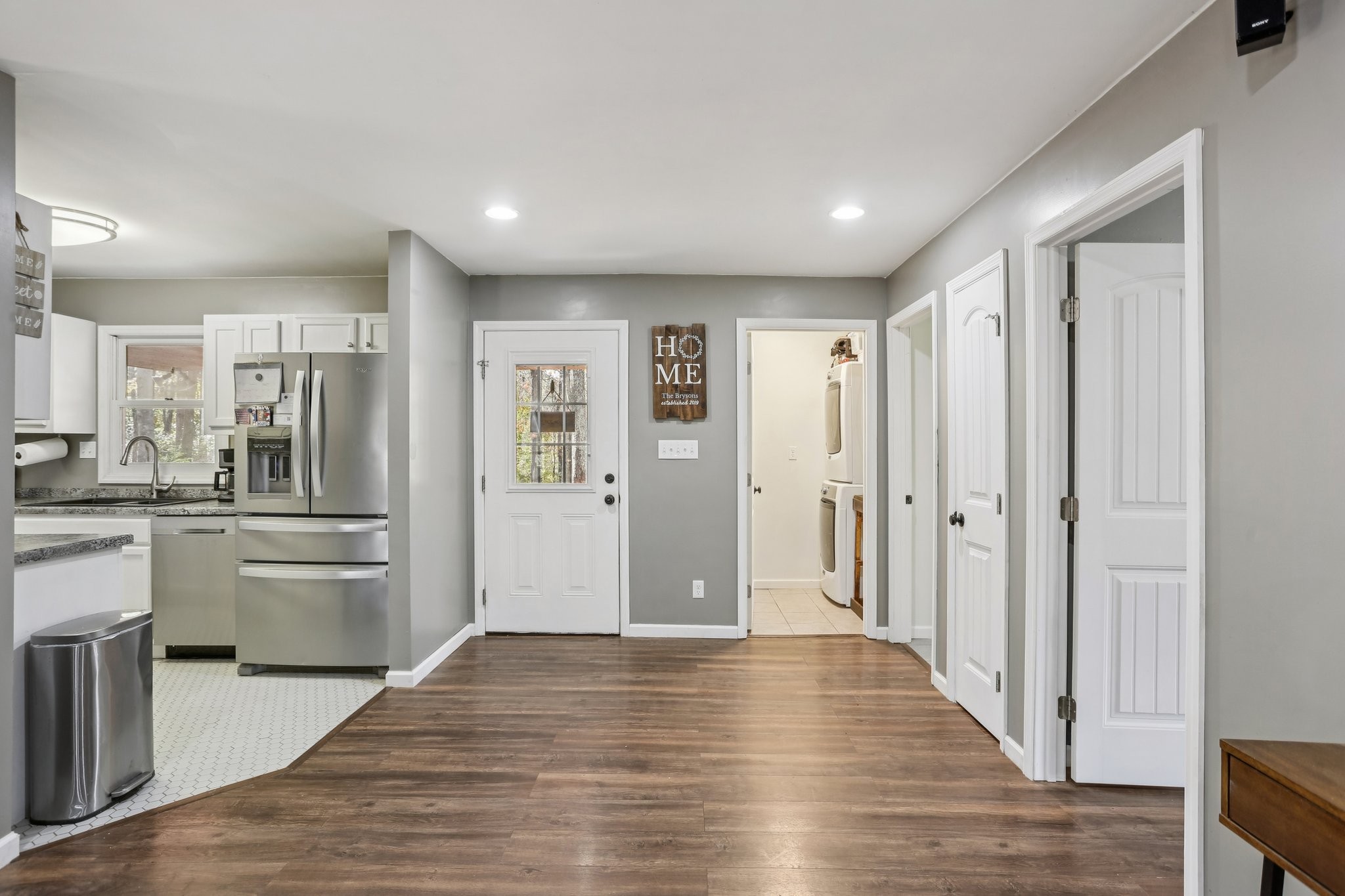 4515 C M Martin Road Springfield, TN 37172 - Photo 12 of 27 a view of a hallway with wooden floor and kitchen