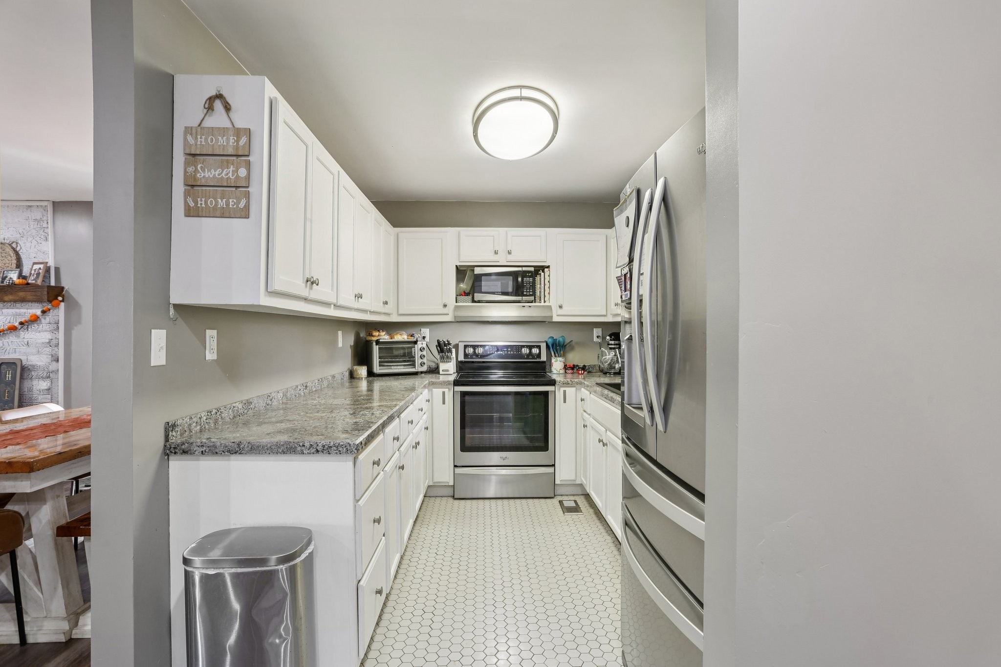 4515 C M Martin Road Springfield, TN 37172 - Photo 13 of 27 a kitchen with stainless steel appliances granite countertop a stove and a refrigerator