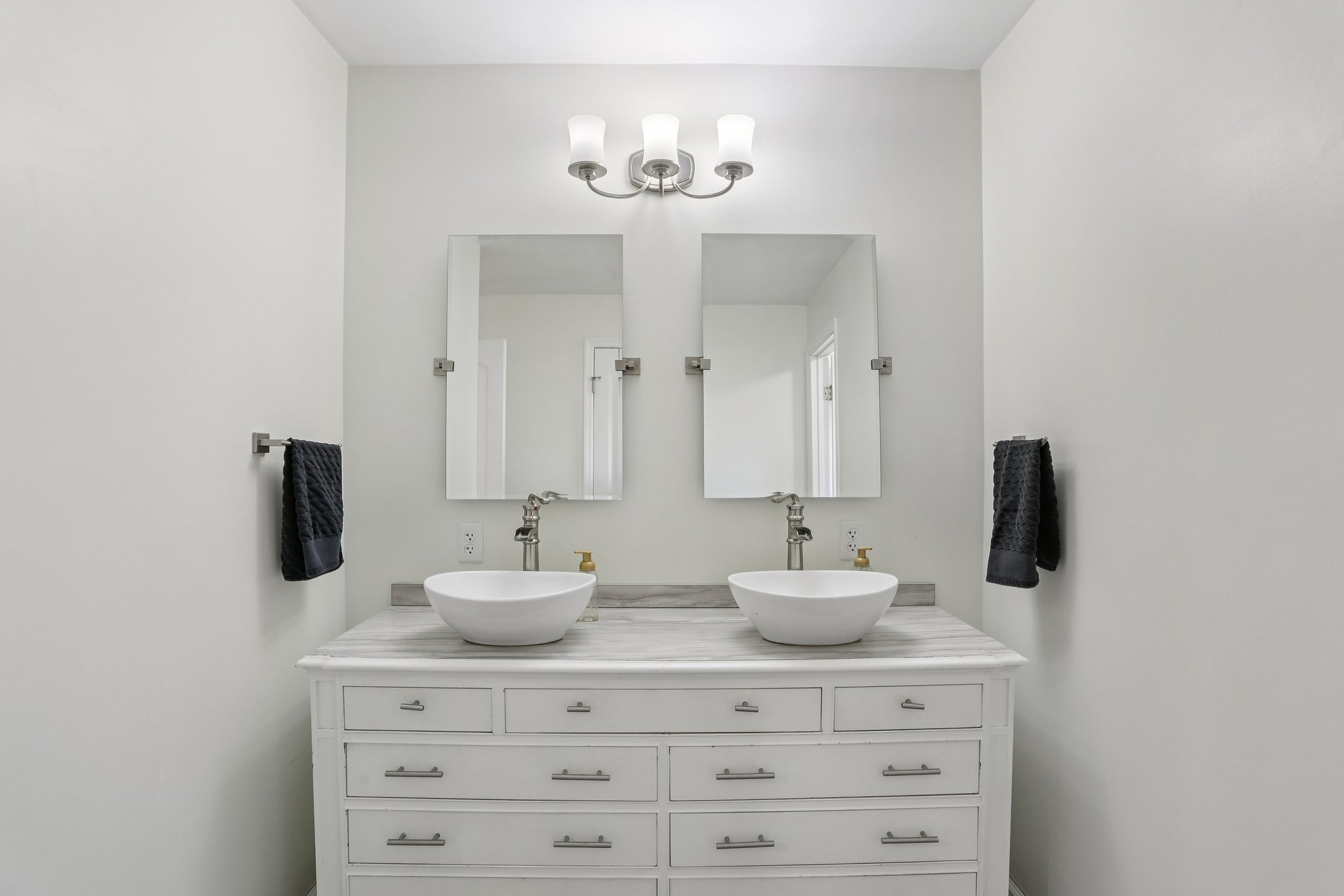 4515 C M Martin Road Springfield, TN 37172 - Photo 22 of 27 a bathroom with a sink vanity and a mirror