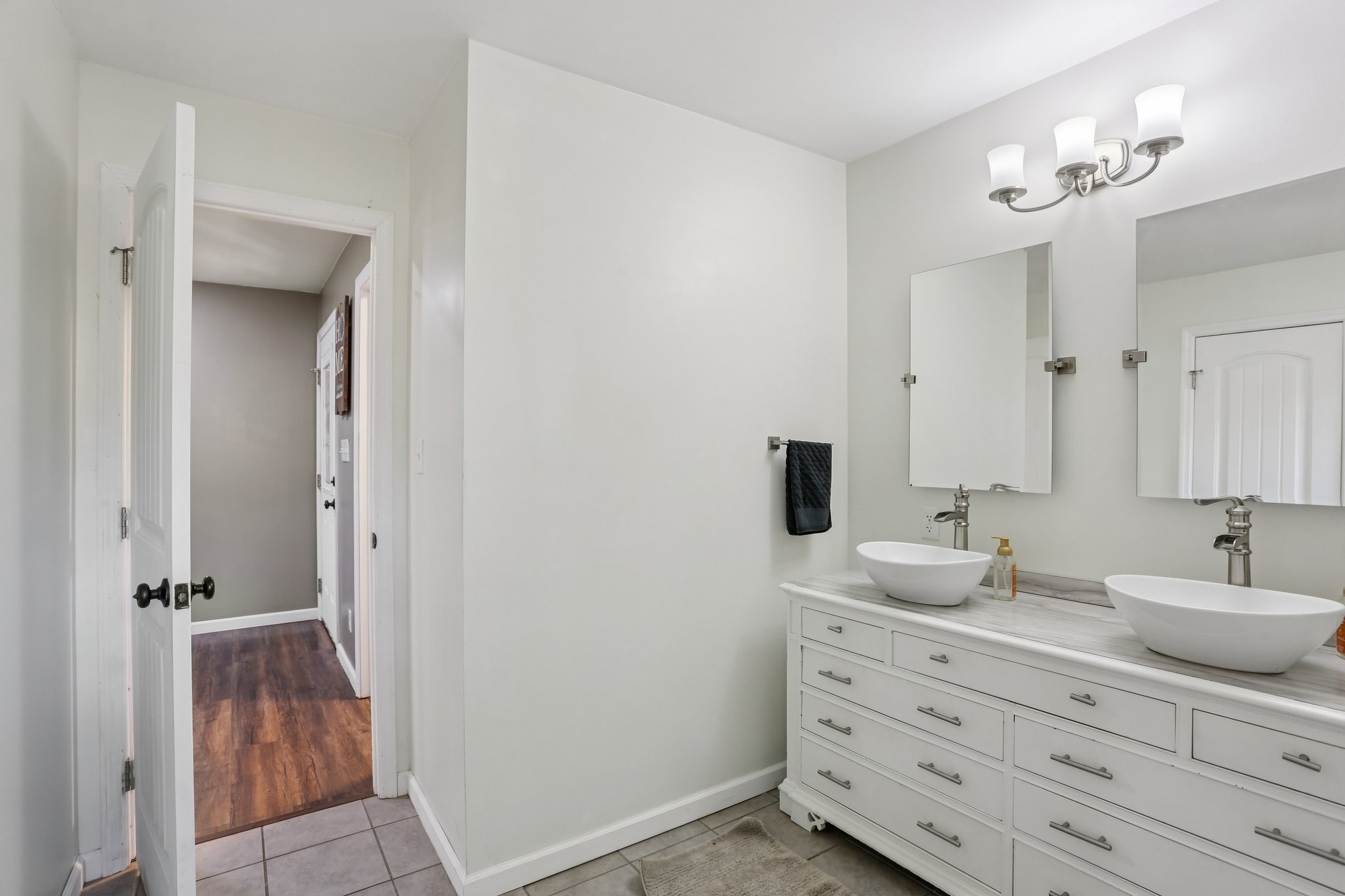 4515 C M Martin Road Springfield, TN 37172 - Photo 24 of 27 a bathroom with a double vanity sink and mirror