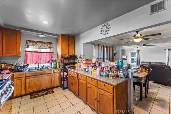 a view of a kitchen with dining table and chairs