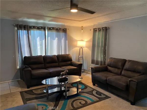 a bedroom with a bed a desk and chair