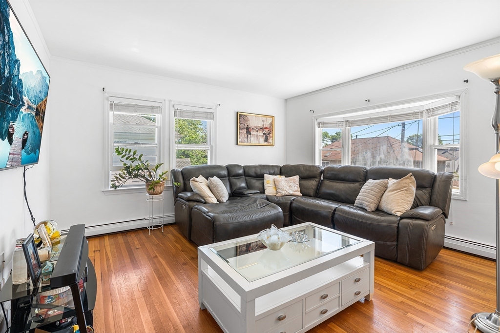 3 Fitz Road Peabody, MA 01960 - Photo 11 of 34 a living room with furniture and a flat screen tv