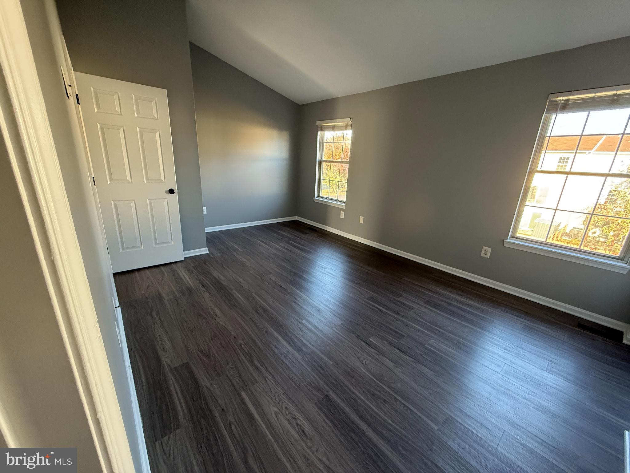 1027 Pirates Court Edgewood, MD 21040 - Photo 12 of 21 a view of an empty room with wooden floor and window