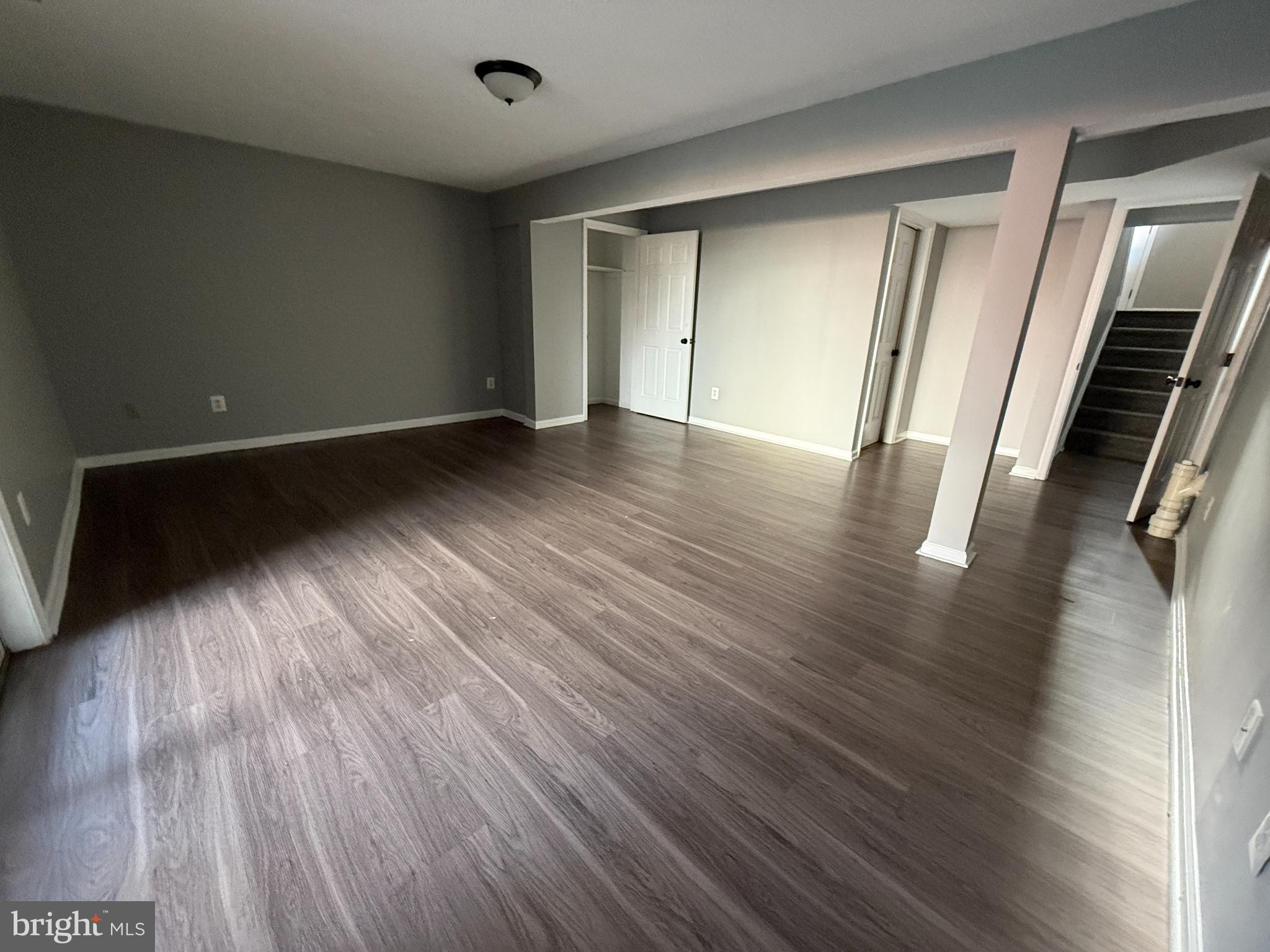 1027 Pirates Court Edgewood, MD 21040 - Photo 18 of 21 an empty room with wooden floor and windows