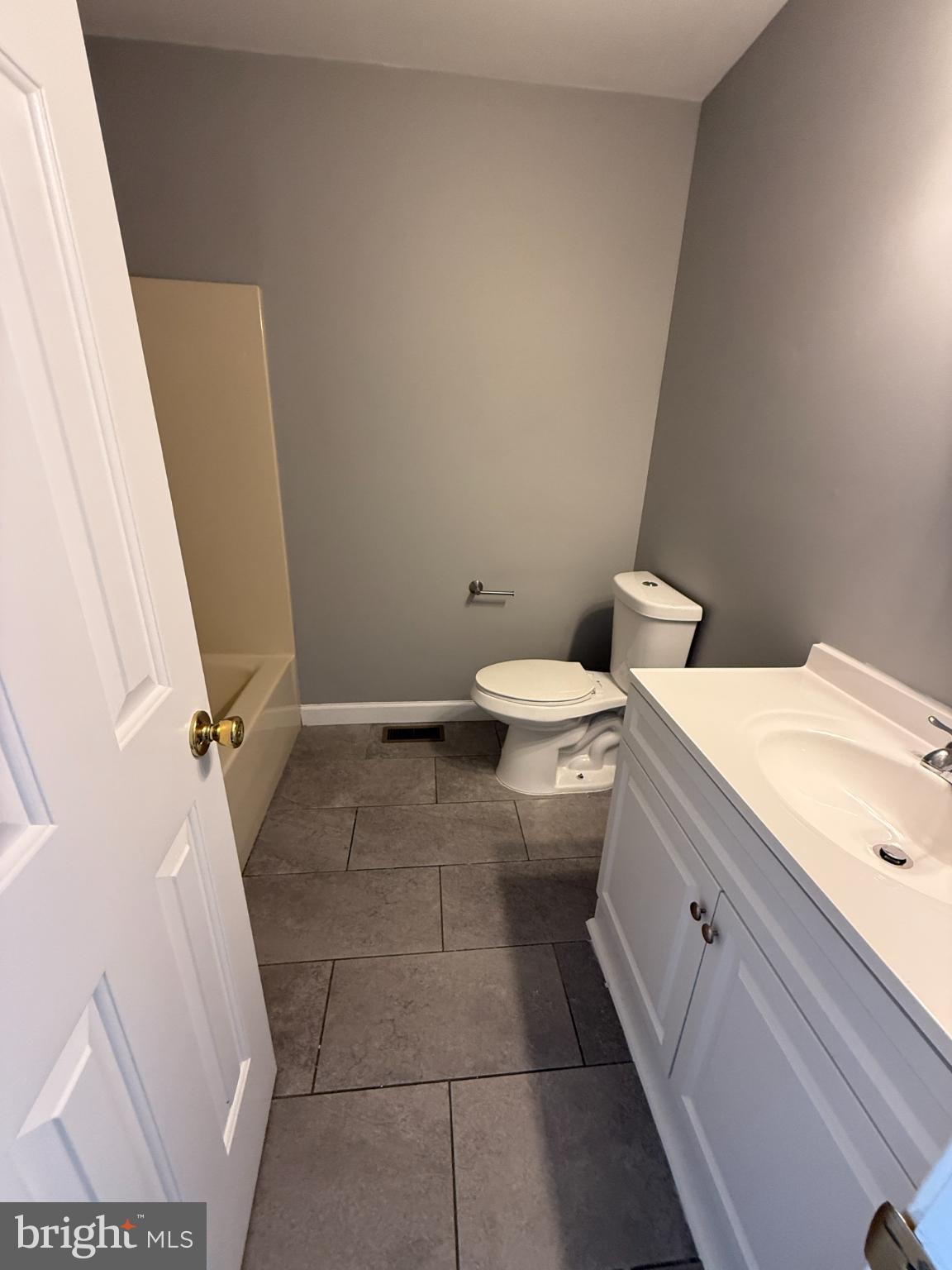 1027 Pirates Court Edgewood, MD 21040 - Photo 9 of 21 a bathroom with a granite countertop toilet and a sink