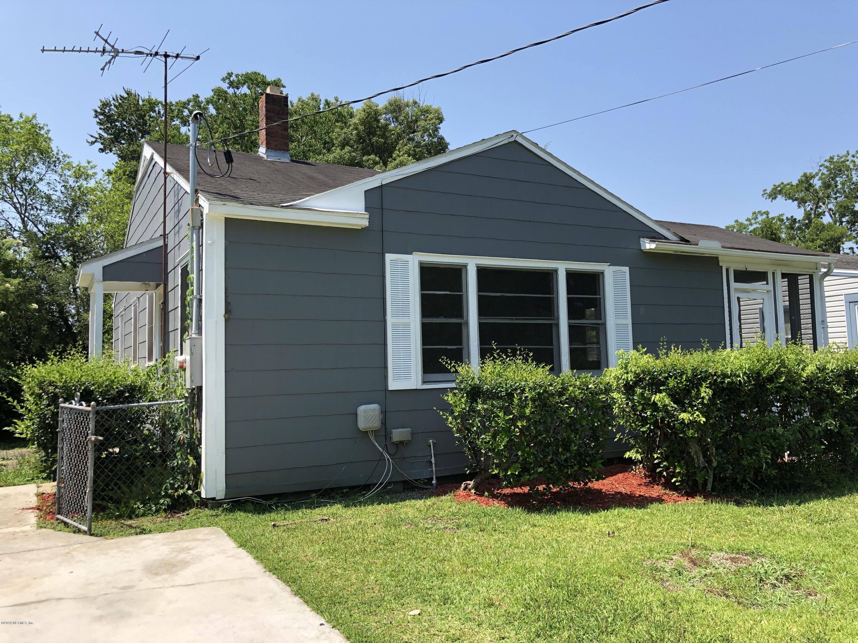 5146 Sunderland Road Jacksonville, FL 32210 - Photo 1 of 10 a front view of a house with garden