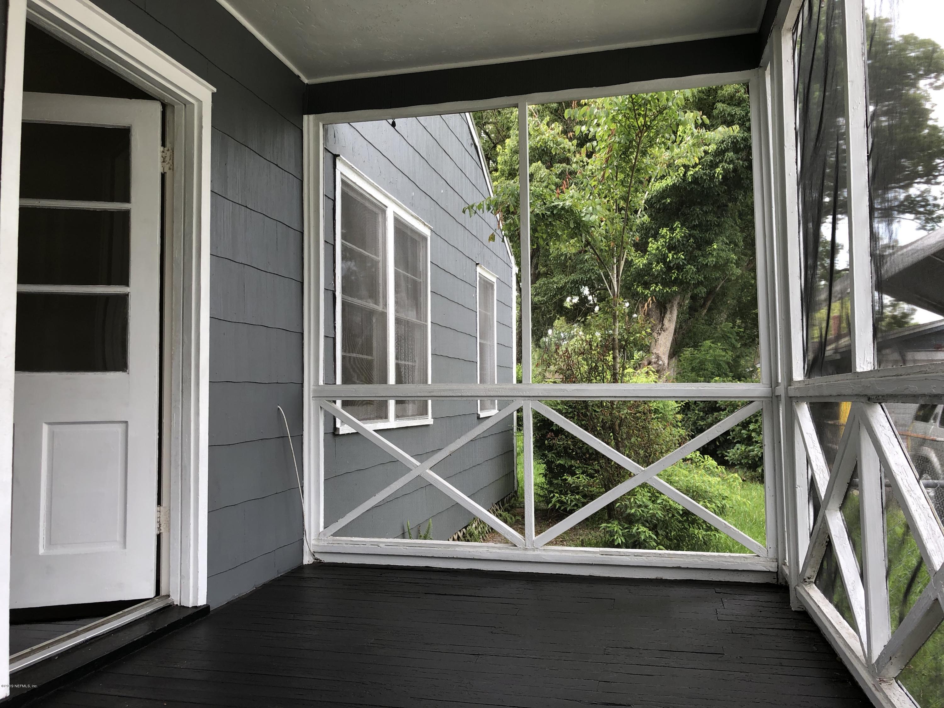 5146 Sunderland Road Jacksonville, FL 32210 - Photo 9 of 10 a view of room with window and wooden floor