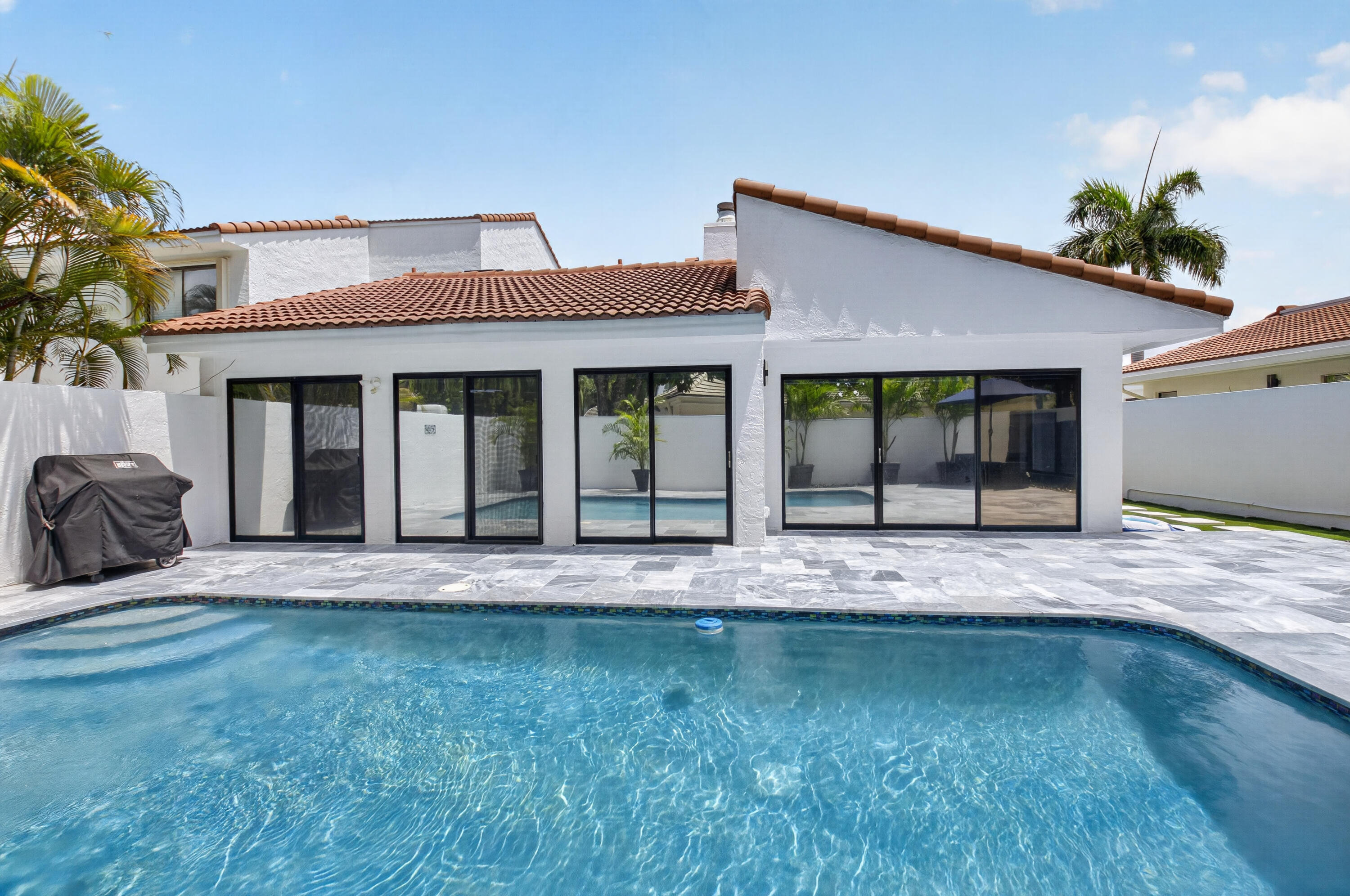 7374 Woodmont Court Boca Raton, FL 33434 - Photo 38 of 95 a view of house with backyard and outdoor space