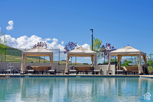 883 Wasatch View Drive, Unit 11 Kamas, UT 84036 - Photo 11 of 14 Community pool with a gazebo and outdoor lounge area
