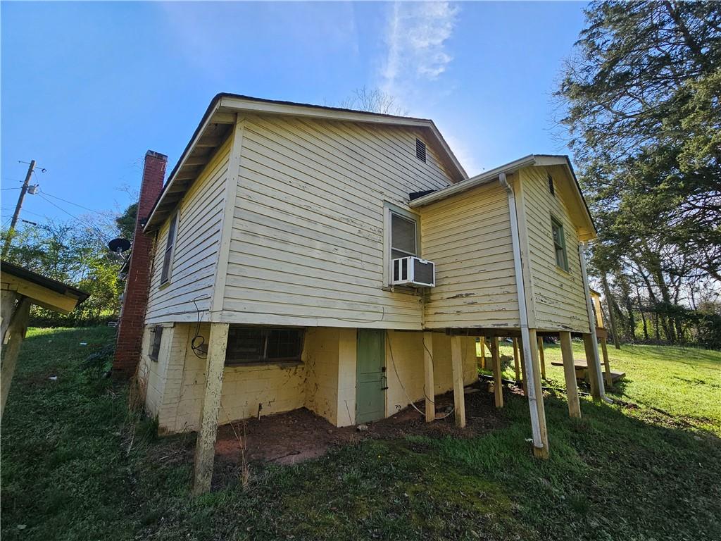 129 Brady Street Toccoa, GA 30577 - Photo 5 of 16 a front view of a house with garden