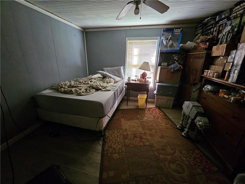 129 Brady Street Toccoa, GA 30577 - Photo 8 of 16 a bed room with a bed and a chair