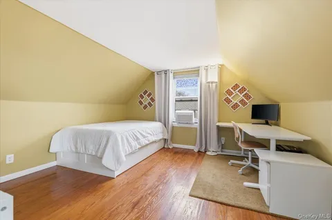 a bedroom with a bed and a table in it