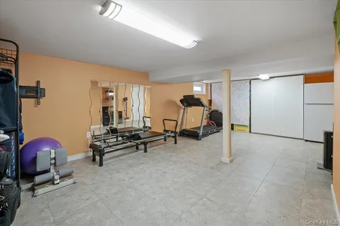 a bedroom with furniture and a ceiling fan
