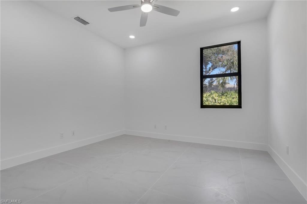 730 29th Street Southwest Naples, FL 34117 - Photo 27 of 50 Empty room featuring recessed lighting and a ceiling fan