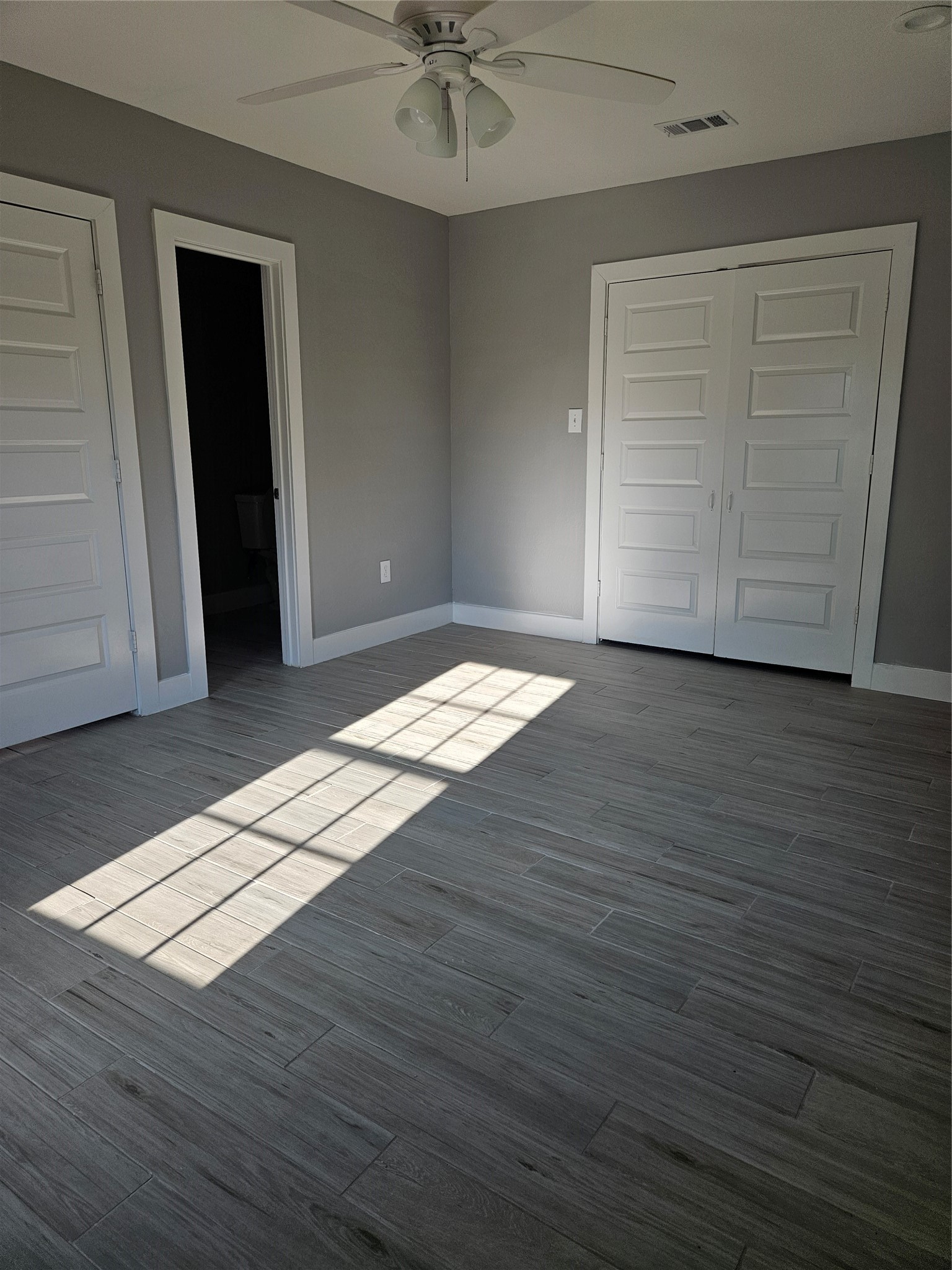 2017 3rd Street Galena Park, TX 77547 - Photo 11 of 23 an empty room with wooden floor closet and windows