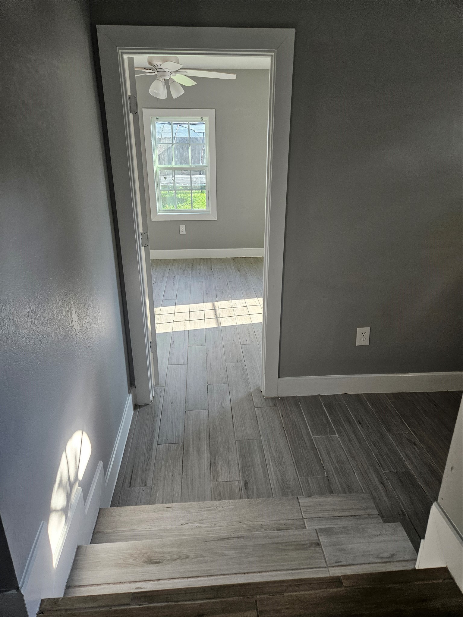 2017 3rd Street Galena Park, TX 77547 - Photo 9 of 23 a view of empty room with wooden floor and fan