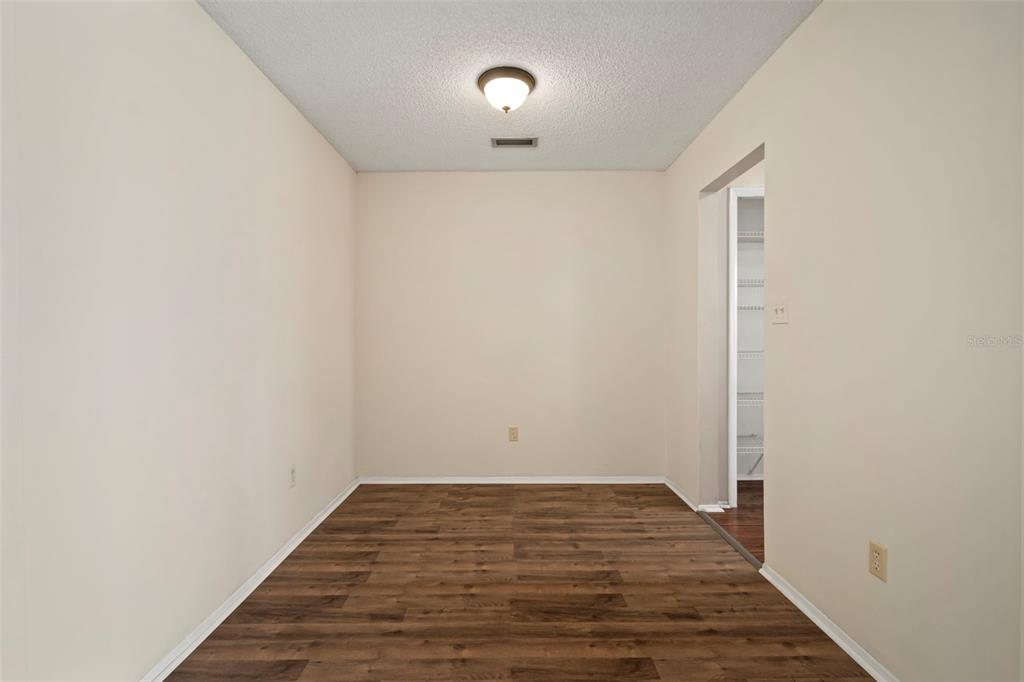 810 Black Knight Drive Valrico, FL 33594 - Photo 12 of 44 a view of room with wooden floor