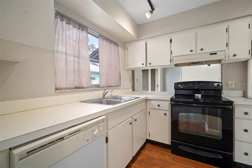 810 Black Knight Drive Valrico, FL 33594 - Photo 16 of 44 a kitchen with a sink stove and cabinets