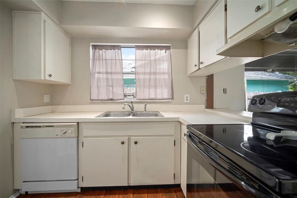 810 Black Knight Drive Valrico, FL 33594 - Photo 18 of 44 a kitchen with a sink stove and cabinets
