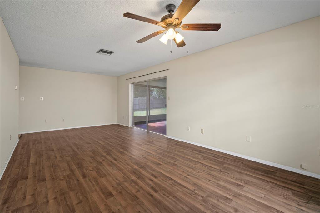 810 Black Knight Drive Valrico, FL 33594 - Photo 19 of 44 wooden floor in an empty room