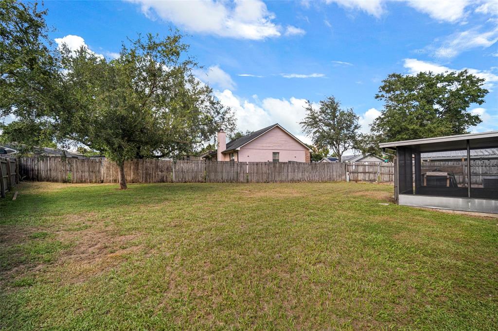810 Black Knight Drive Valrico, FL 33594 - Photo 2 of 44 a view of a house with backyard and garden