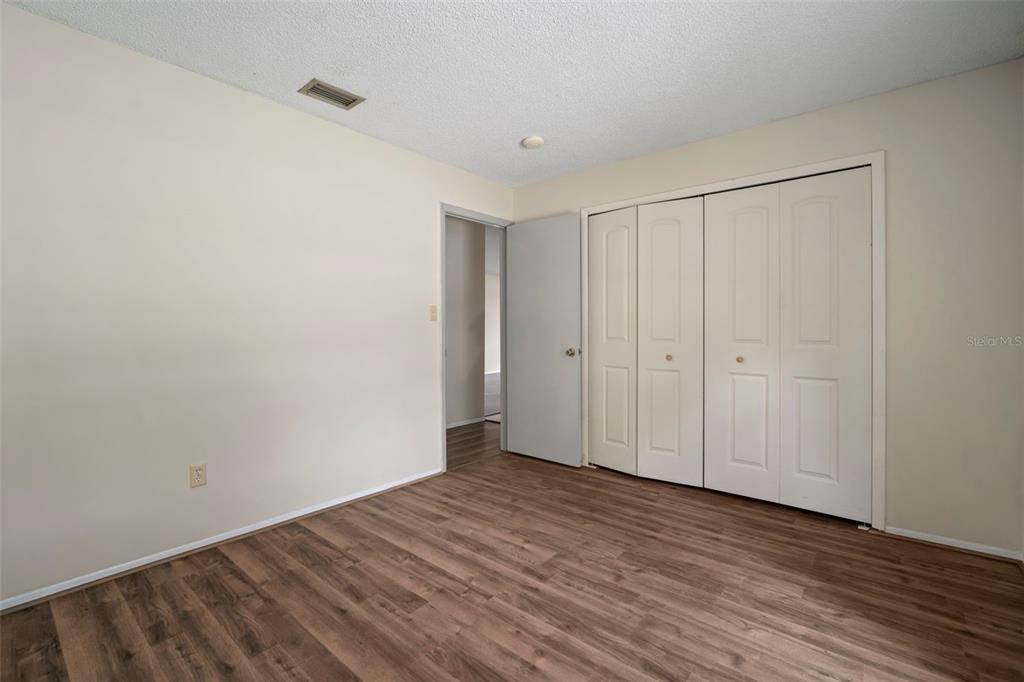 810 Black Knight Drive Valrico, FL 33594 - Photo 26 of 44 a view of room with wooden floor